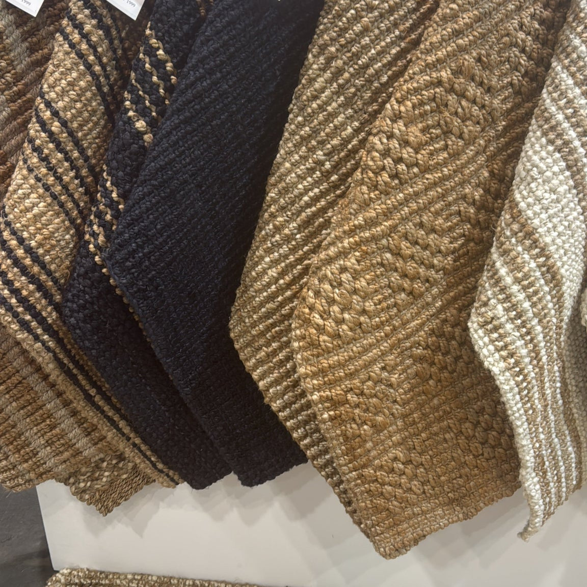 Armstrong Natural Tile Rug - Stack of textured fabric swatches